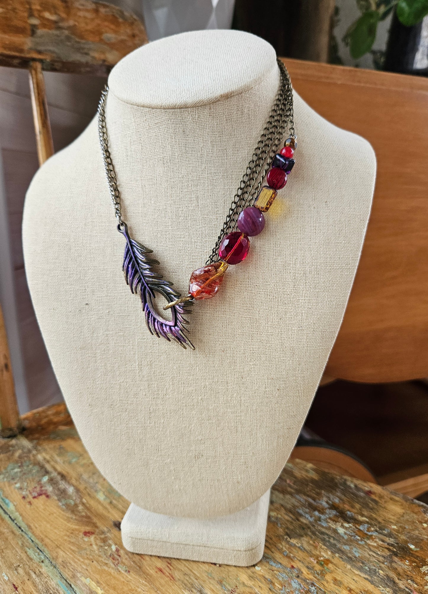 Collier Peakaboo rouge et mauve